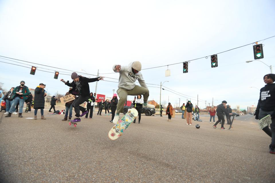 Skate boarders in support of Tyre Nichols do skate boarding tricks the intersection of Poplar and Danny Thomas Blvd, near the Shelby County Jail on Feb. 4, 2023 in Memphis.