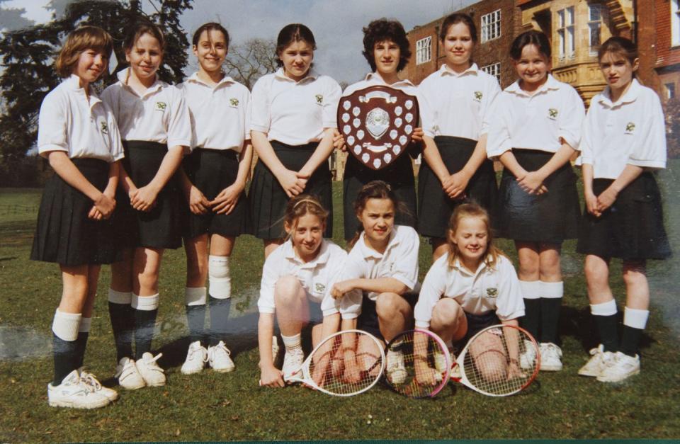 <p>While Kate's favorite sport was field hockey, she was also a star tennis player. Here, she posed with her tennis teammates at St Andrew's School. Young Kate (top, third from left) looked adorable in her uniform. </p>
