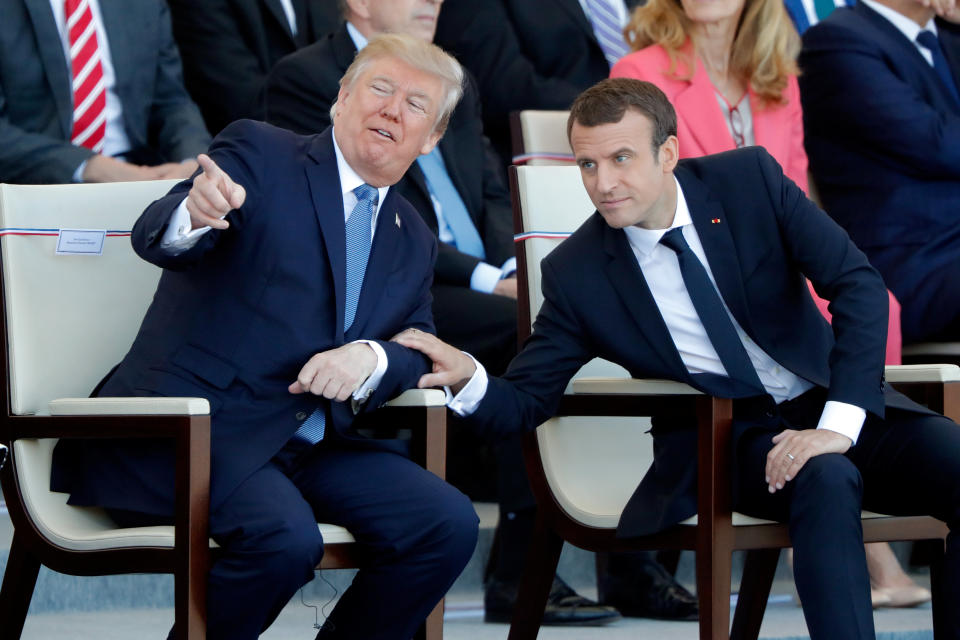 French President Emmanuel Macron and U.S. President Donald Trump attend the traditional Bastille Day military parade on the Champs-Elysees in Paris on July 14, 2017.