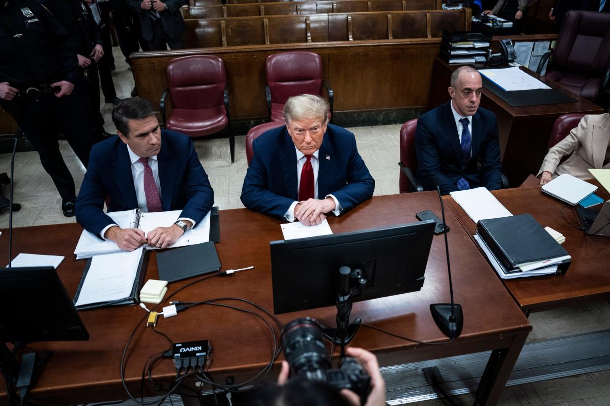 Former President Donald Trump, center, appears with his legal team Todd Blanche, left, and Emil Bove, right, ahead of the start of jury selection at Manhattan Criminal Court on April 15, 2024 in New York City. Trump faces 34 felony counts of falsifying business records in the first of his criminal cases to go to trial.