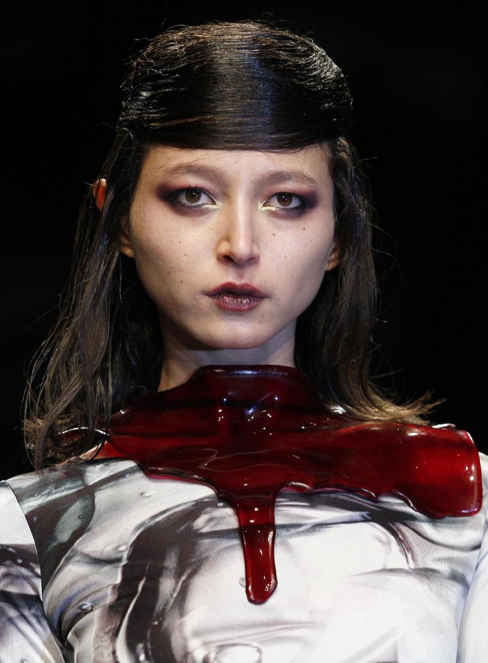 A model displays a creation by designer Aminaka Wilmont during a fashion show at London Fashion Week, Tuesday, Feb. 21, 2012. (AP Photo/Kirsty Wigglesworth)