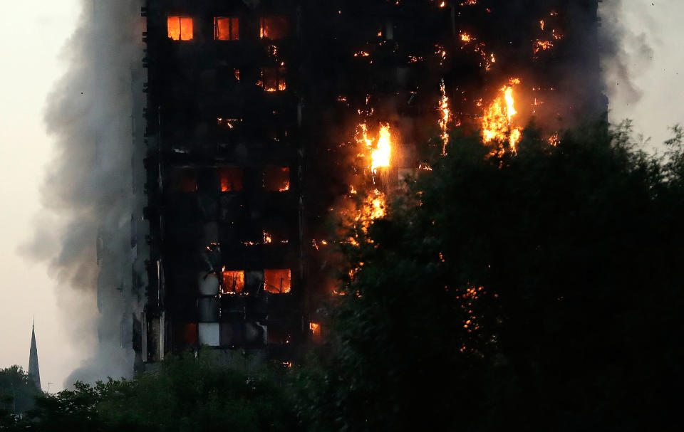 <p>Smoke and flames rise from a building on fire in London, Wednesday, June 14, 2017.(Matt Dunham/AP) </p>