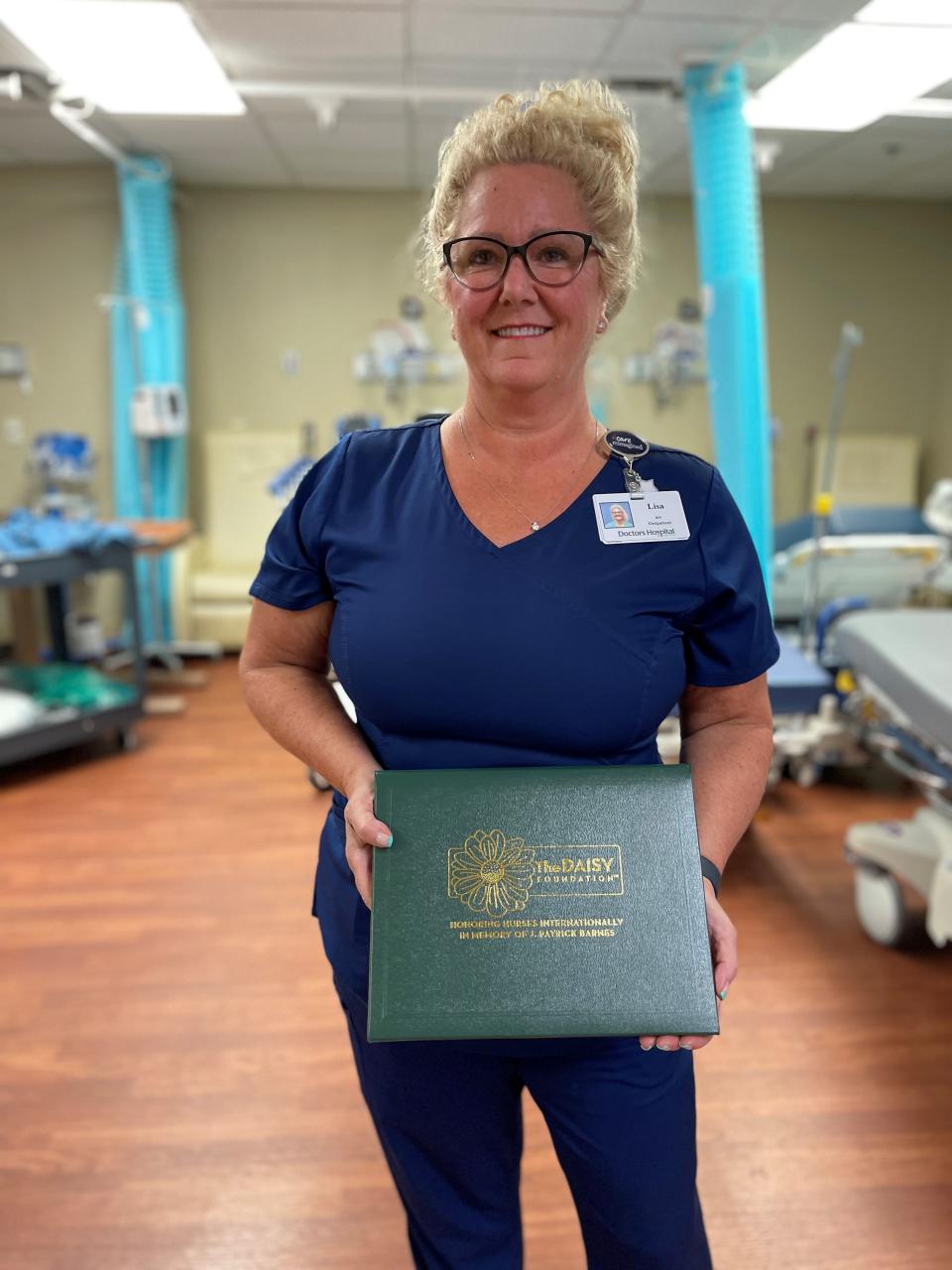 Nurse Lisa Lilligren, with her DAISY Award at HCA Florida Sarasota Doctors Hospital.