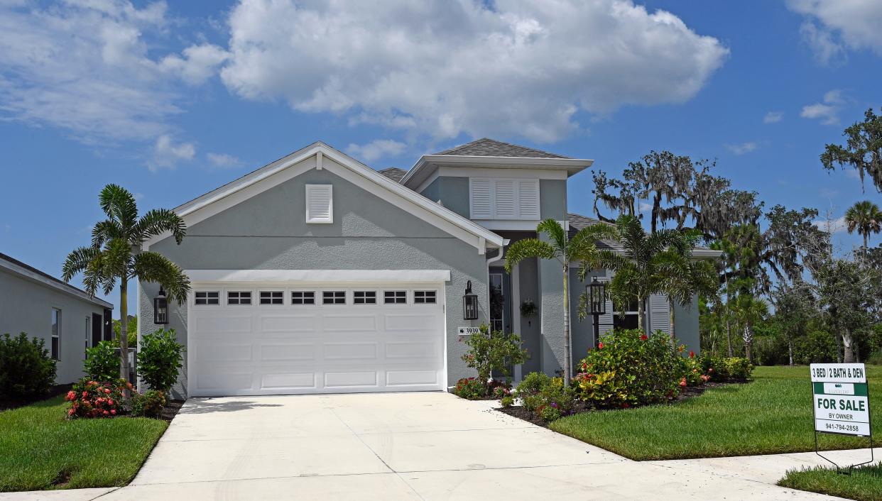 A three-bedroom house for sale by owner in Parrish, Florida, is shown. Across the United States, median home prices were $450,000, up 0.7% from a month earlier, Realtor.com said.