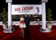 Cast member George Clooney and his wife Amal pose at the premiere of "Hail, Caesar!" in Los Angeles, California February 1, 2016. The movie opens in the U.S. on February 5. REUTERS/Mario Anzuoni