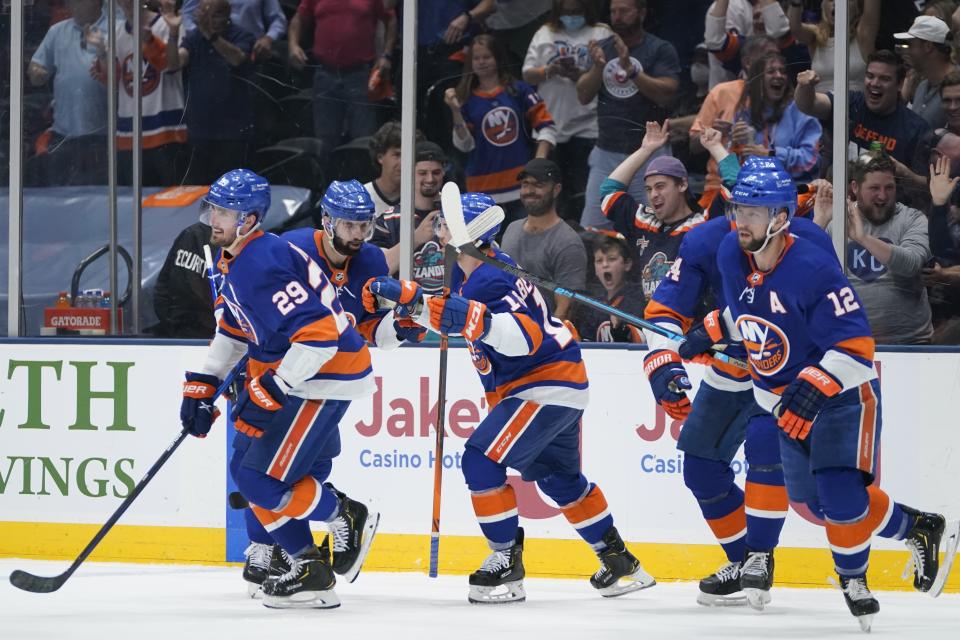 New York Islanders' Brock Nelson (29) celebrates with teammates after scoring a goal during the second period of Game 6 during an NHL hockey second-round playoff series against the Boston Bruins Wednesday, June 9, 2021, in Uniondale, N.Y. (AP Photo/Frank Franklin II)