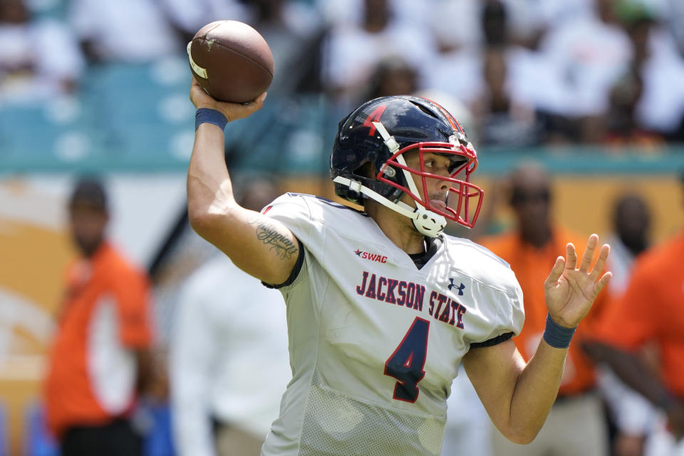 Jackson State quarterback Jason Brown (4) stands back to pass during the first half of the Orange Blossom Classic NCAA college football game against Florida A&M, Sunday, Sept. 3, 2023, in Miami Gardens, Fla. (AP Photo/Lynne Sladky)