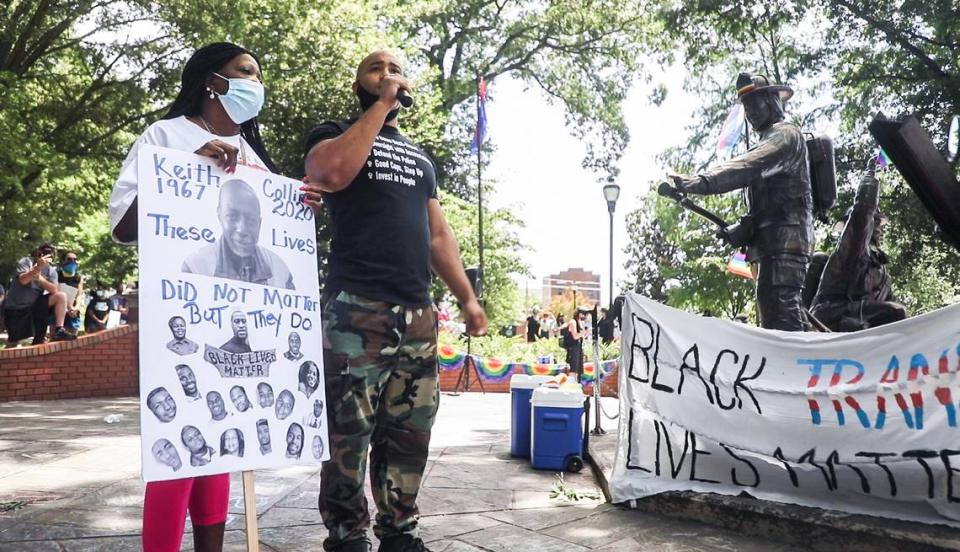 Kerwin Pittman speaks to the crowd in Nash Square during a Pride in solidarity with Black Lives Matter protest before a march through downtown Raleigh, N.C. on Sunday, June 28, 2020. Pittman advocates on behalf community members affected by police violence, including Gloria Mayo, left, whose son Keith Collins was killed by a Raleigh Police officer in January.