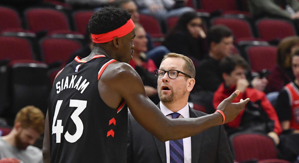 Toronto Raptors head coach Nick Nurse talks with Toronto Raptors forward Pascal Siakam (43) during the second half of an NBA basketball game against the Chicago Bulls Saturday Oct. 26, 2019, in Chicago. (AP Photo/Matt Marton)