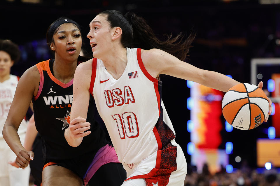 PHOENIX, ARIZONA - JULY 20: Breanna Stewart #10 of Team USA drives over Angel Reese #5 of Team WNBA during the fourth quarter during the 2024 WNBA All Star Game at Footprint Center on July 20, 2024 in Phoenix, Arizona. (Photo by Alex Slitz/Getty Images)