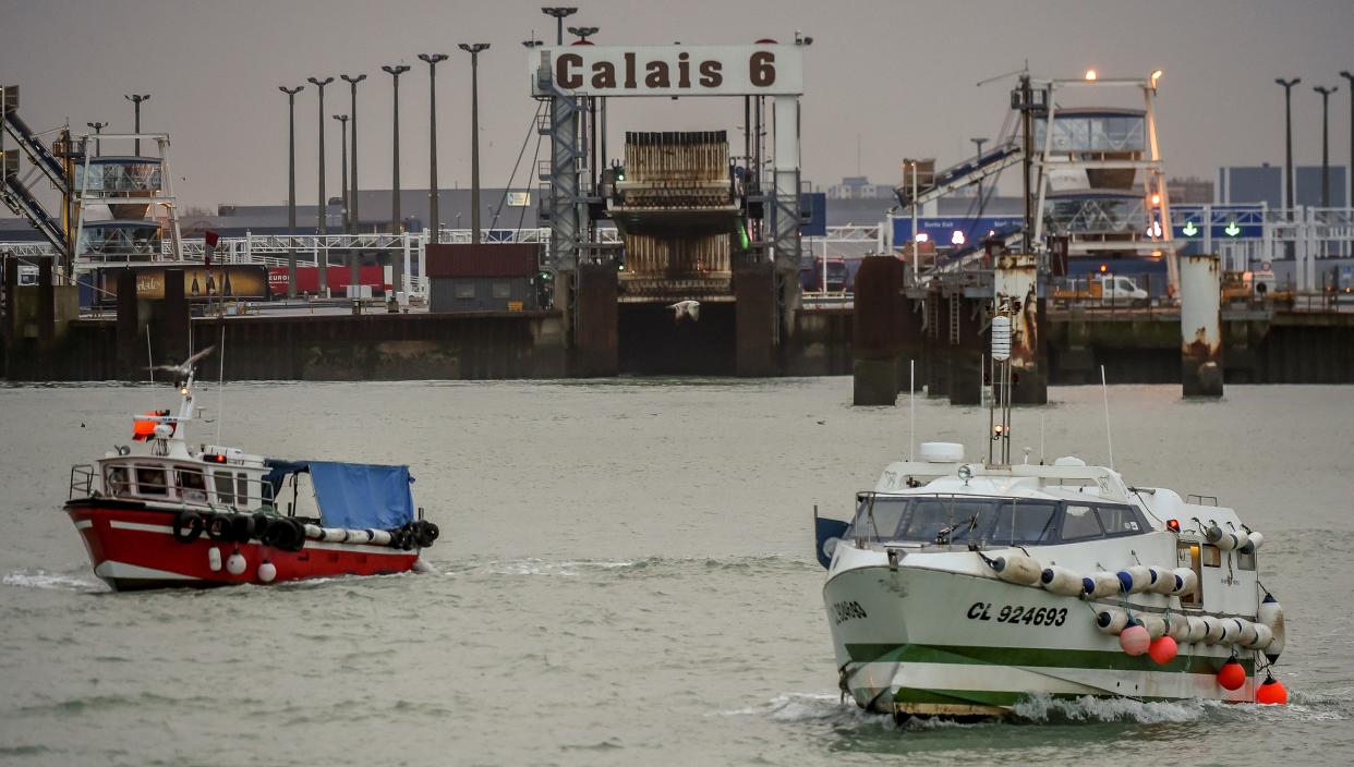 Fishing boats leave the harbour of Calais on January 25, 2018 to take part in a blockade to protest against electric pulse fishing practiced by fishermen from Netherlands. French fishermen blocked the port of Calais, preventing cross-Channel ferries arriving or departing, and a road leading to the port of Boulogne-sur-Mer, about 30 kilometres (20 miles) southwest of Calais, to demand a ban on electric pulse fishing in the North Sea.  Pulse fishing involves dragging electrically-charged lines just above the seafloor that shock marine life up from low-lying positions into trawling nets.  / AFP PHOTO / Philippe HUGUEN        (Photo credit should read PHILIPPE HUGUEN/AFP/Getty Images)