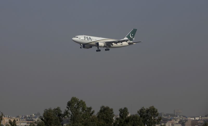 FILE PHOTO: A Pakistan International Airlines (PIA) passenger plane arrives at the Benazir International airport in Islamabad, Pakistan