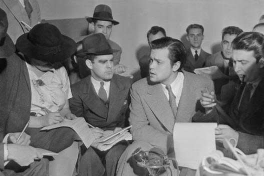 Author Orson Welles meets with reporters on October 31 1938 to explain the radio broadcast of The War of the Worlds was not expected to cause panic. Photo courtesy Acme News Photo/Wikipedia
