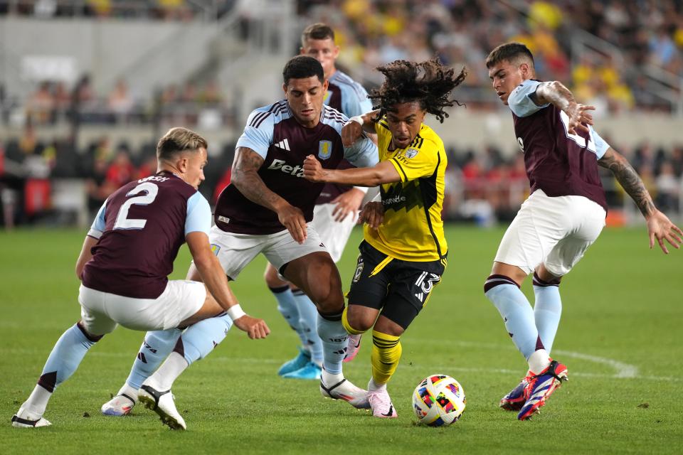 COLUMBUS, OHIO - JULY 27: Aziel Jackson #13 of the Columbus Crew battles Enzo Barrenechea #21, Diego Carlos #3 and Matty Cash #2 of Aston Villa for the ball during the second half at Lower.com Field on July 27, 2024 in Columbus, Ohio. (Photo by Jason Mowry/Getty Images)