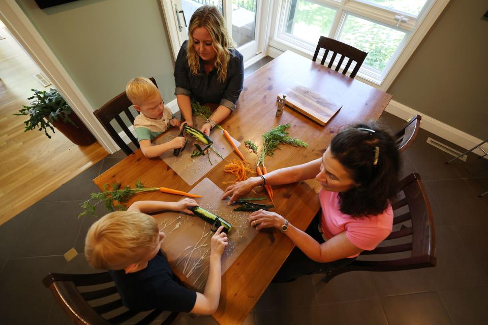 Dr. Bonnie Feola works with Michelle and her sons Ellis and Anderson at her home in Salt Lake City on Wednesday, July 26, 2023. Feola works with kids and parents on learning about eating healthy and how to prepare food. | Scott G Winterton, Deseret News