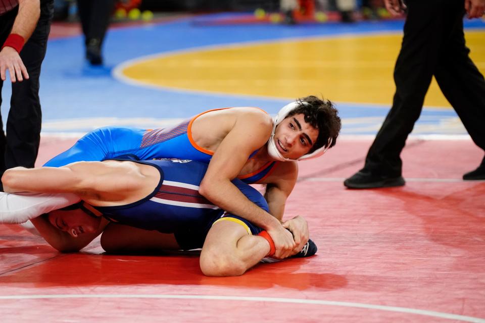 Malik Asfour of Lodi, top, wrestles Jared Brunner of Eastern in a 113-pound quarterfinal bout on Day 2 of the NJSIAA state wrestling championships in Atlantic City on Thursday, March 4, 2022.