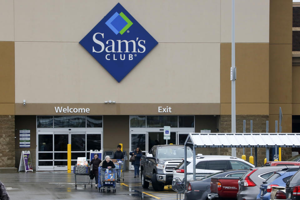 File- This Feb. 23, 2018, file photo shows shoppers leaving a Sam's Club in Pittsburgh. Walmart’s Sam’s Club is teaming up with several health care companies to offer discounts on everyday care its customers might delay or skip because of the cost. Starting early October, Sam’s Club members in Michigan, Pennsylvania and North Carolina, will be able to buy one of four bundles of health care services ranging in annual fees from $50 for individuals to $240 for a family of up to six members. The pilot program could potentially be rolled out to members in all the states, says Lori Flees, senior vice president of Sam’s Club Health and Wellness. (AP Photo/Gene J. Puskar, File)