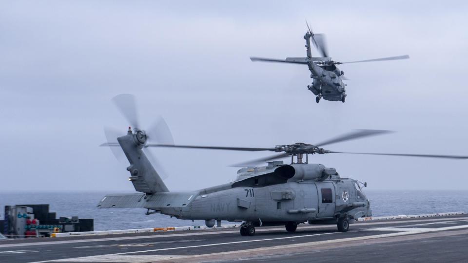 An MH-60R Sea Hawk helicopter, from the "Battlecats" of Helicopter Maritime Strike Squadron 73, takes off of the flight deck of the aircraft carrier USS Nimitz. An MH-60R crashed into the San Diego Bay on Jan. 11, 2024, and military officials said all six people on board survived.