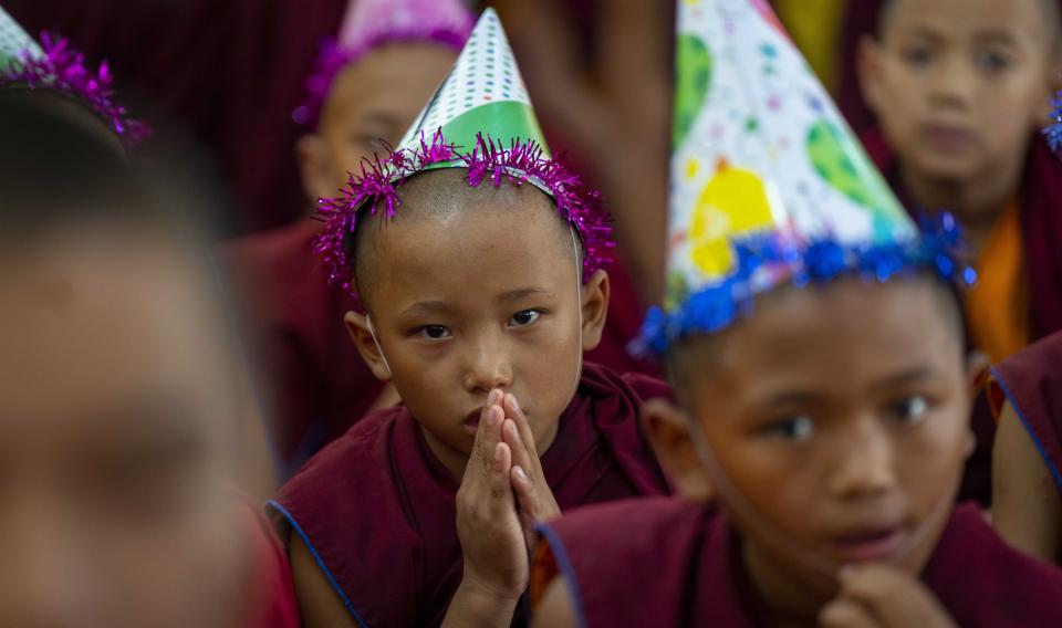 Young monks offer prayers during celebrations to mark the birthday of their spiritual leader the Dalai Lama in Kathmandu, Nepal, Thursday, July 6, 2023. (AP Photo/Niranjan Shrestha)
