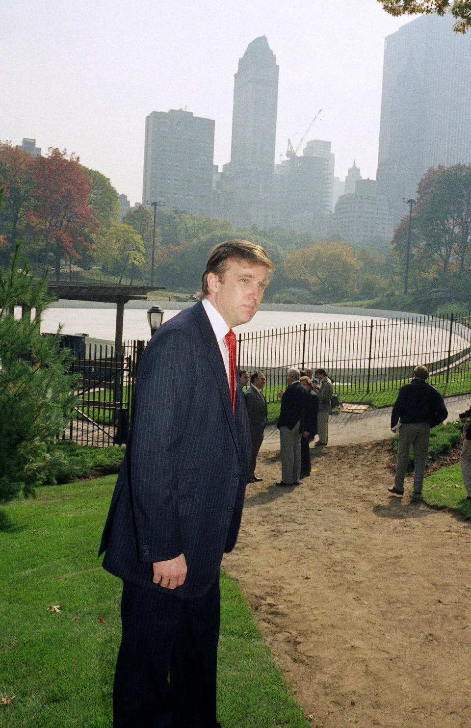 FILE - In this Oct. 23, 1986, file photo, Donald Trump is photographed in New York's Central Park, in front of the Wollman Skating Rink, which he offered to rebuild after the city's renovation effort had come to a standstill. As President-elect Trump came of age as a public figure during the 1980s, he opened up a refurbished Grand Hyatt on 42nd Street, took over the long-stalled renovation of Central Park’s ice skating rink and purchased the New York-area team in the fledgling United States Football League. (AP Photo/Mario Suriani, File)