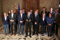 Catalan Regional President Carles Puigdemont (C) is flanked by members of his government as he makes an statement at Generalitat Palace in Barcelona, Spain, October 1, 2017. Catalan Goverment/Jordi Bedmar Pascual/Handout via REUTERS