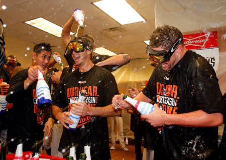 Oct 5, 2014; Detroit, MI, USA; Baltimore Orioles players celebrate their win in the locker room after defeating the Detroit Tigers in game three of the 2014 ALDS baseball playoff game at Comerica Park. The Orioles move on to the ALCS with 2-1 win over the Tigers. Mandatory Credit: Rick Osentoski-USA TODAY Sports