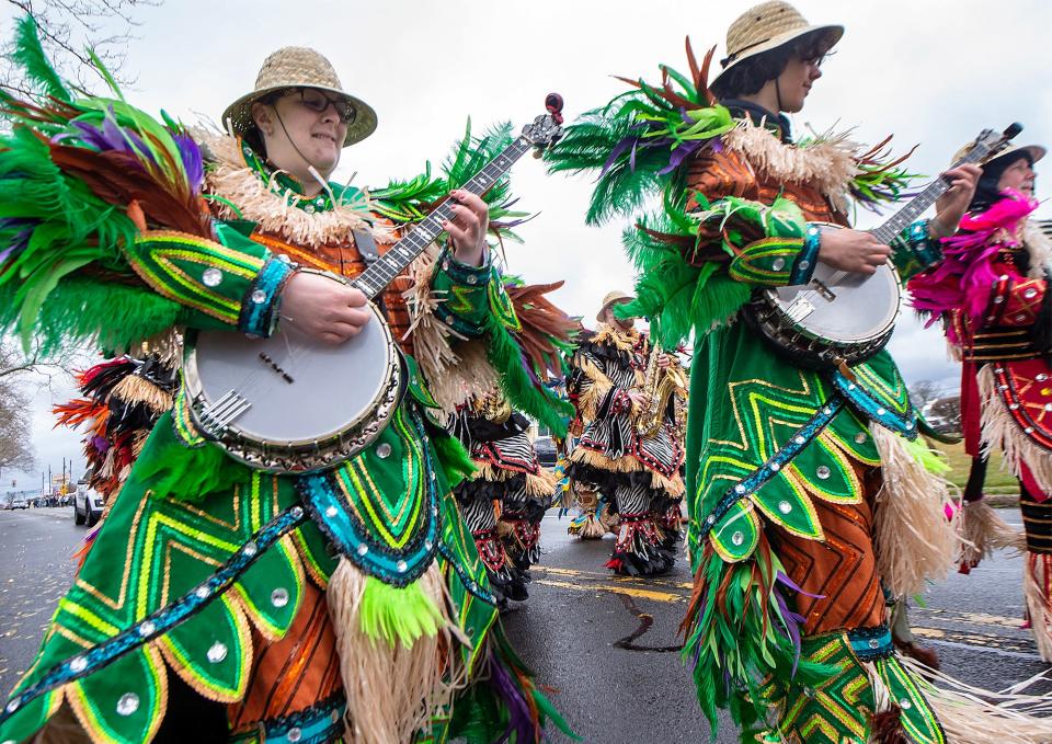 Members of the Uptown String Band strut down New Falls Road ,during the 34th annual Saint Patrick's Day parade, held in Levittown, on Saturday, Mar. 11, 2023.