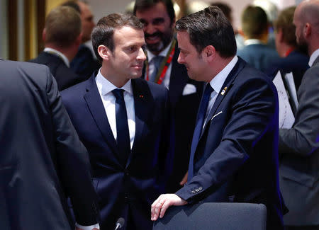 French President Emmanuel Macron talks with Luxembourg Prime Minister Xavier Bettel during a European Union leaders informal summit in Brussels, Belgium, February 23, 2018. REUTERS/Yves Herman