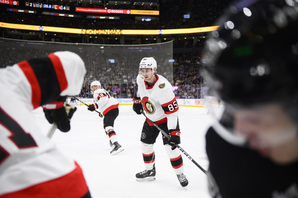 Ottawa Senators defenseman Jake Sanderson (85) looks for a pass during the second period of the team's NHL hockey game against the Toronto Maple Leafs on Friday, Jan. 27, 2023, in Toronto. (Christopher Katsarov/The Canadian Press via AP)