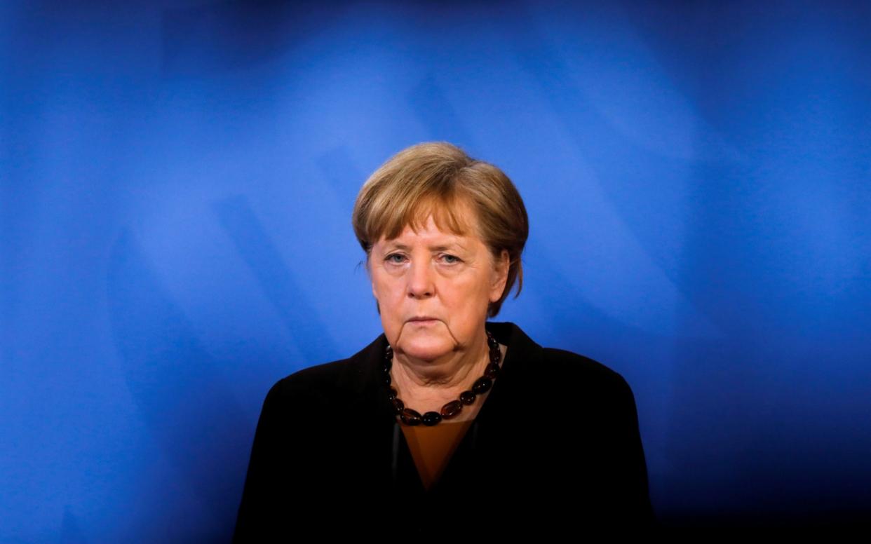 FILE PHOTO: FILE PHOTO: German Chancellor Angela Merkel briefs the media after a virtual meeting with federal state governors at the chancellery in Berlin, Germany, March 30, 2021. Markus Schreiber/Pool via REUTERS/File Photo/File Photo - POOL/REUTERS