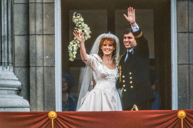 View of just-married couple Sarah, Duchess of York, and Prince Andrew, Duke of York, as they wave from the balcony of Buckingham Palace, London, England, July 23, 1986.