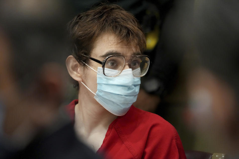 Marjory Stoneman Douglas High School shooter Nikolas Cruz is shown at the defense table during a hearing at the Broward County Courthouse in Fort Lauderdale, Fla. on Monday, Nov. 15, 2021. Attorneys for Cruz told a judge Monday that detectives made false statements to get the search warrants allowing them to seize evidence from his cellphone and bedroom, including an argument over whether burgundy and maroon are the same color. (Amy Beth Bennett/South Florida Sun Sentinel via AP, Pool)