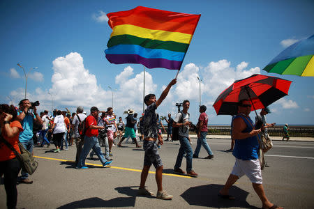 FILE PHOTO: Gay rights activists get together before the Annual March against Homophobia and Transphobia in Havana, May 14, 2016. REUTERS/Alexandre Meneghini