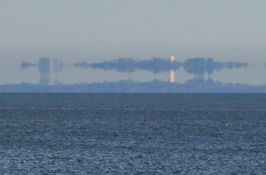 Courtesy: Doug Kishman: Refraction of Kelly’s Island in foreground of Perry Monument on Put-in-Bay: If you look closely for a moment you’ll notice it’s a mirage making the island appear to be floating, according to Jay Reynolds