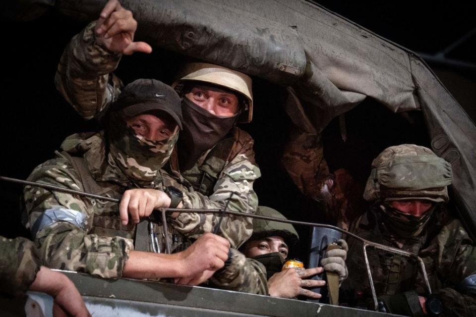 Members of Wagner group looks from a military vehicle in Rostov-on-Don late on June 24, 2023.