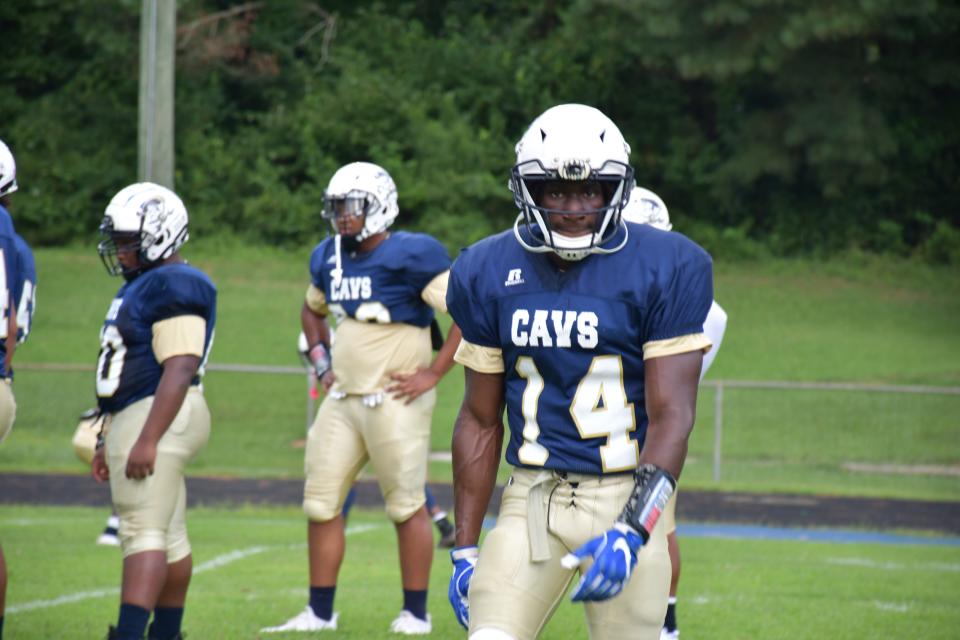 Cummings sophomore Jonathan Paylor goes through warmups ahead of last fall's game against Williams High School.