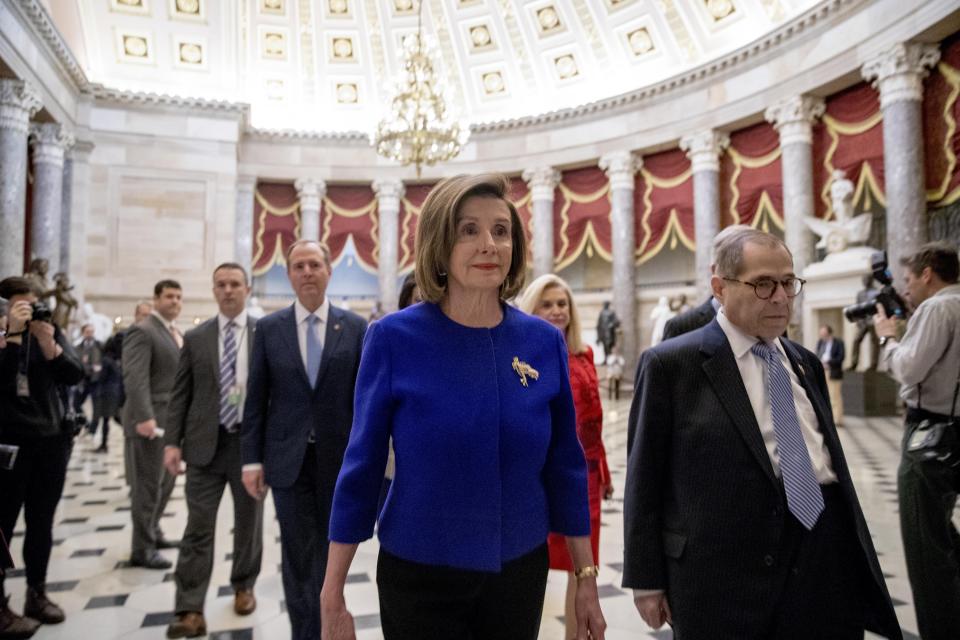 House Speaker Nancy Pelosi of Calif., with from left, Adam Schiff, D-Calif., Chairman of the House Intelligence Committee, Chairwoman of the House Oversight and Reform Committee Carolyn Maloney, D-N.Y., and Chairman of the House Judiciary Committee Jerrold Nadler, D-N.Y., walk to a news conference to unveil articles of impeachment against President Donald Trump, abuse of power and obstruction of Congress, Tuesday, Dec. 10, 2019, on Capitol Hill in Washington. (AP Photo/Andrew Harnik)