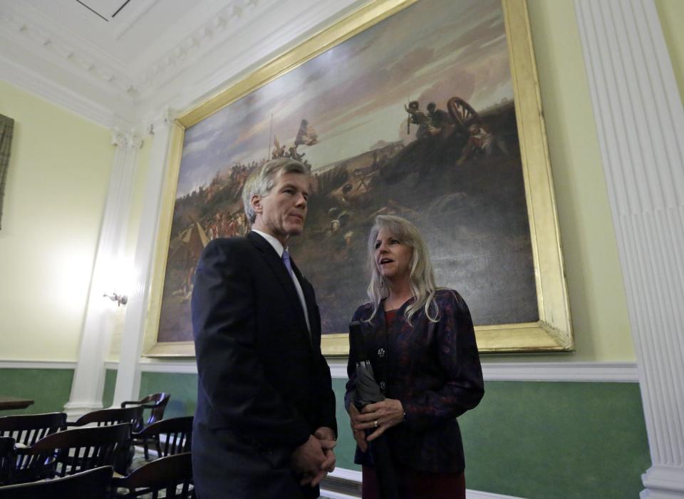 Outgoing Virginia Gov. Bob McDonnell and his wife, Maureen, wait in the old Senate Chambers prior to the inauguration of Virginia Governor Terry McAuliffe at the Capitol in Richmond, Va., Saturday, Jan. 11, 2014. McAuliffe was sworn in as the 72nd Governor of Virginia. (AP Photo/Steve Helber)