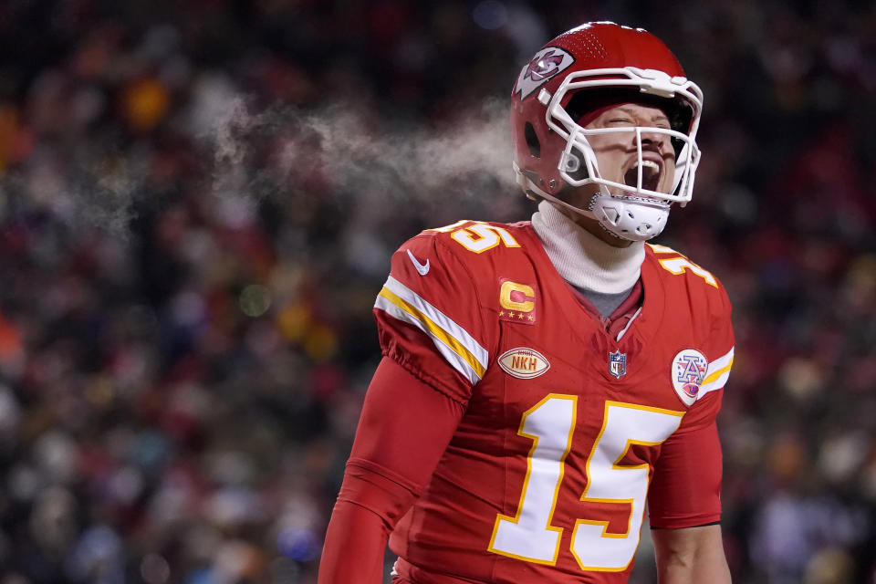 Kansas City Chiefs quarterback Patrick Mahomes (15) celebrates after throwing a touchdown pass during the first half of an NFL wild-card playoff football game against the Miami Dolphins Saturday, Jan. 13, 2024, in Kansas City, Mo. (AP Photo/Ed Zurga)