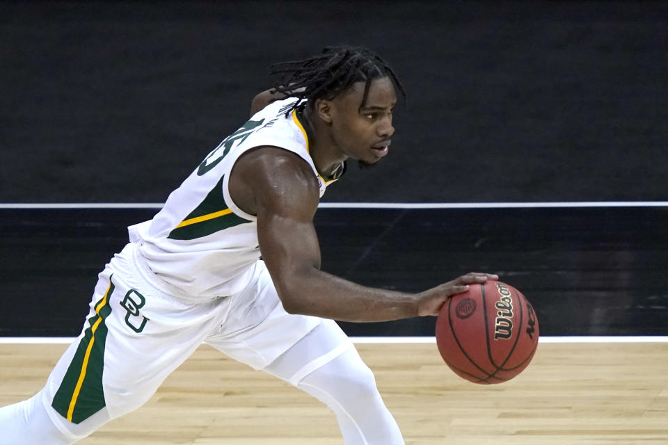 FILE - In this March 11, 2011, file photo, Baylor's Davion Mitchell drives during the second half of the team's NCAA college basketball game against Kansas State in the second round of the Big 12 men's tournament in Kansas City, Mo. Mitchell was selected by the Sacramento Kings in the NBA draft Thursday, July 29, 2021. (AP Photo/Charlie Riedel, File)https://epix.ap.org/#