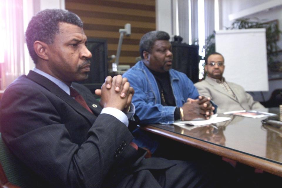 March 3, 2000 -- Urban League's Ben Richmond, left, ponders a question during a press conference by minority leaders about the recent police awards ceremony. In the middle is Rev. Louis Coleman, at right is Rev. George Moore of Quinn Chapel, AME Church.