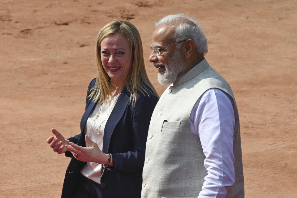 Italian Premier Giorgia Meloni, left, talks to Indian Prime Minister Narendra Modi, as she leaves after her ceremonial reception at the Indian Presidential Palace in New Delhi, India, Thursday, March 2, 2023.(AP Photo)