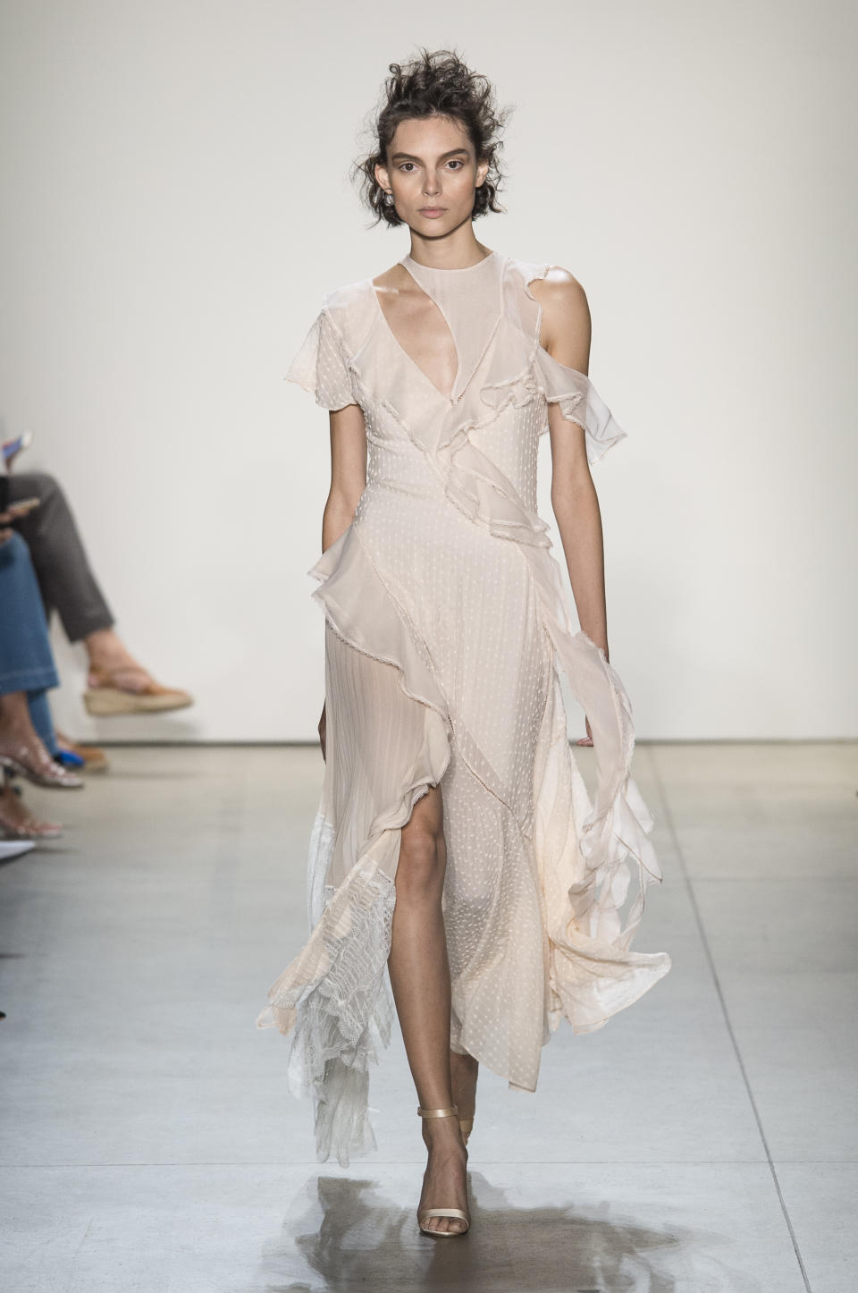 <p><i>Model wears a sheer ruffled dress from the SS18 Jonathan Simkhai collection. (Photo: ImaxTree) </i></p>