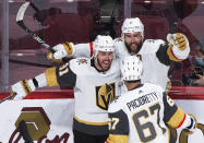 Vegas Golden Knights' Alex Pietrangelo (7) celebrates with Jonathan Marchessault (81) and Max Pacioretty after scoring against the Montreal Canadiensduring the third period of Game 3 of an NHL hockey semifinal series, Friday, June 18, 2021, in Montreal. (Graham Hughes/The Canadian Press via AP)
