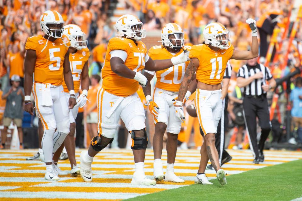 Tennessee wide receiver Jalin Hyatt (11) celebrates a touchdown against Alabama at Neyland Stadium on October 15, 2022. On the left is quarterback Hendon Hooker (5), who led the mighty Vols to their electrifying victory by 52-49.  Brianna Paciorka/News Sentinel