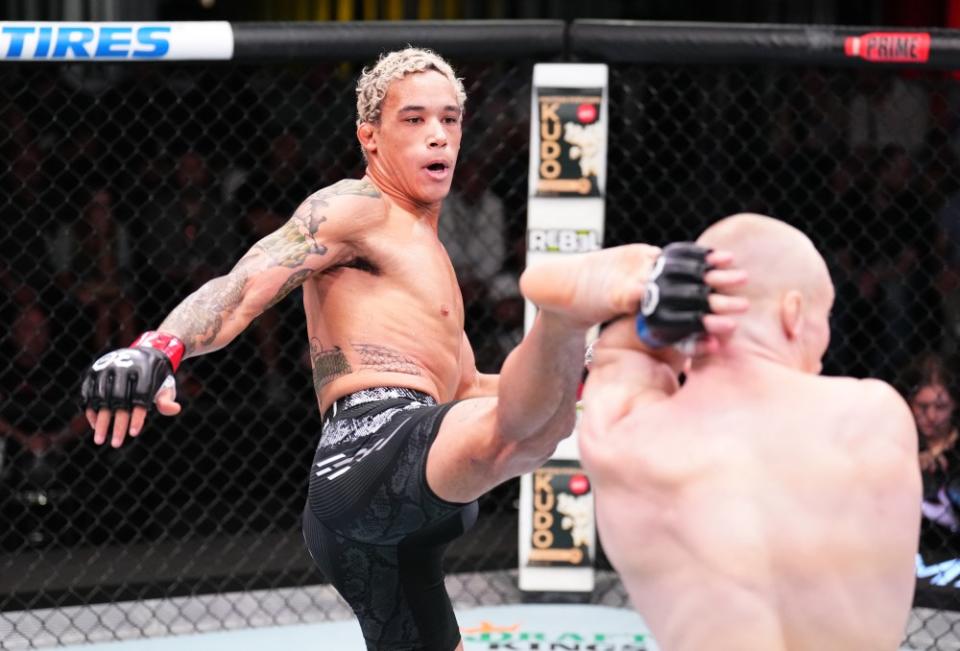 LAS VEGAS, NEVADA – SEPTEMBER 23: (L-R) Bryan Battle kicks AJ Fletcher in a welterweight fight during the UFC Fight Night event at UFC APEX on September 23, 2023 in Las Vegas, Nevada. (Photo by Chris Unger/Zuffa LLC via Getty Images)