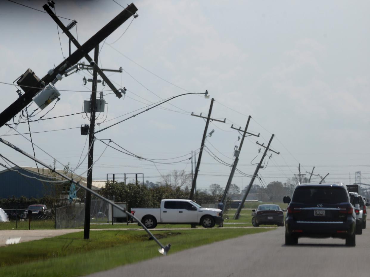 File: President Joe Biden’s motorcade drives past an area affected by Hurricane Ida on Saturday (Reuters)