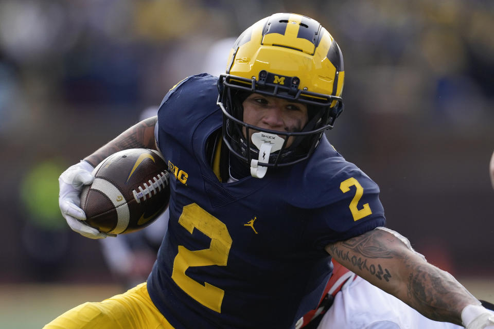 FILE - Michigan running back Blake Corum (2) runs the ball against Illinois in the first half of an NCAA college football game in Ann Arbor, Mich., Saturday, Nov. 19, 2022. Michigan opens their season at home against East Carolina on Sept. 2. (AP Photo/Paul Sancya, File)