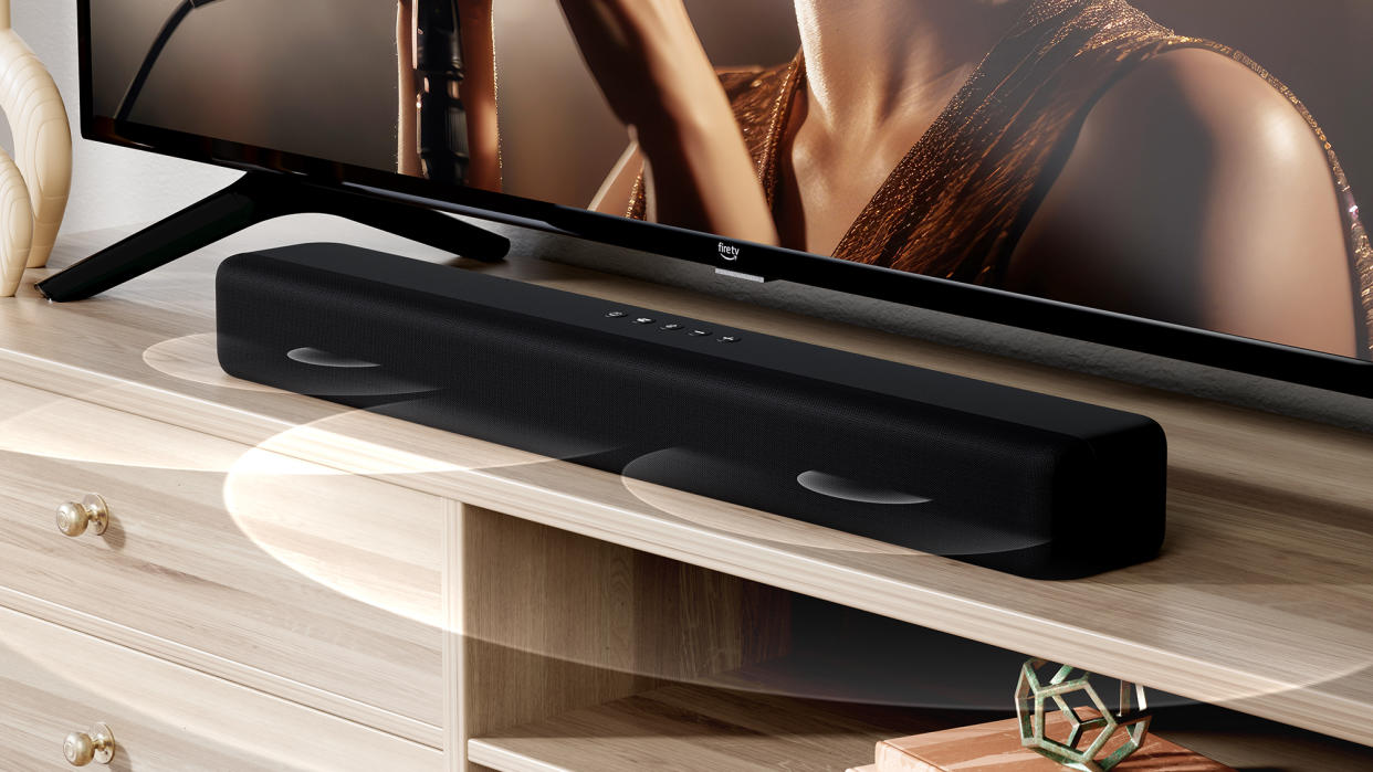  A press image of the Amazon Fire TV Soundbar, of it on a wooden shelf. 