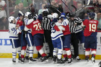 Players fight during the first period of an NHL hockey game between the Florida Panthers and the Toronto Maple Leafs, Tuesday, April 16, 2024, in Sunrise, Fla. (AP Photo/Wilfredo Lee)